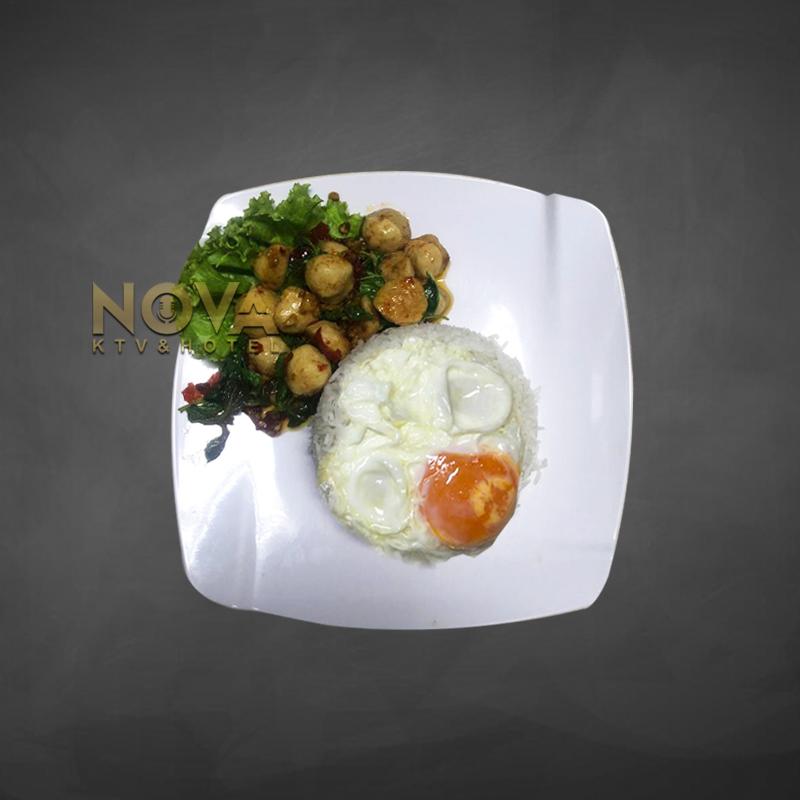 Stir-fry pork meatballs with holy basil and rice served