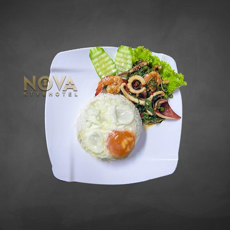 Stir-fried seafood with holy basil and rice served