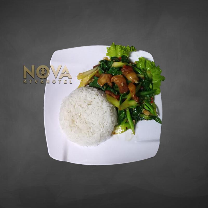 Stir-fried cauliflower with crispy pork belly and rice served